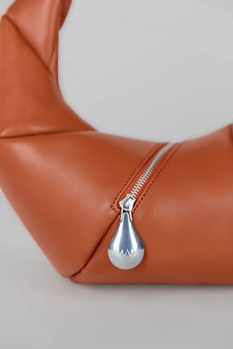 Rust leather handbag